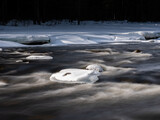 Ice breaking up in spring at a  Scandinavian river. Long exposure for smoothly flowing water. Shot in Sweden, Europe