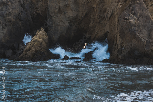 Waves crashing through rocks in Big Sur, California