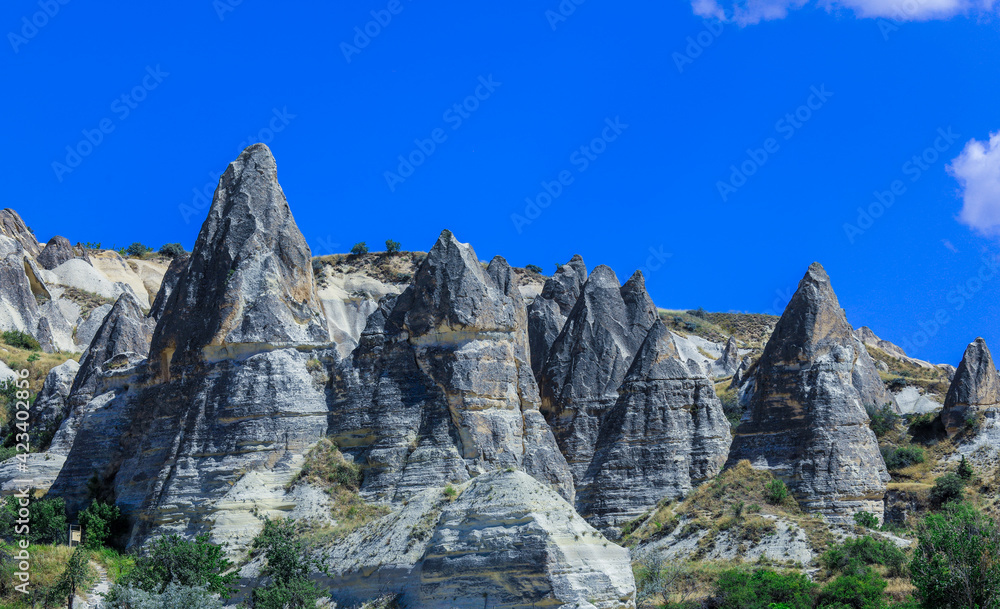 Fantastic View to the Göreme with rock houses in front of the spectacularly coloured valleys nearby, Cappadocia, Turkey Fantastic View to the Göreme with rock houses in front of the spectacularly coloured valleys nearby, Cappadocia, Turkey