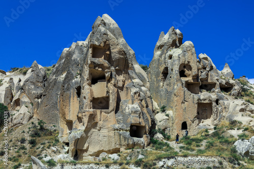 Fantastic View to the Göreme with rock houses in front of the spectacularly coloured valleys nearby, Cappadocia, Turkey
