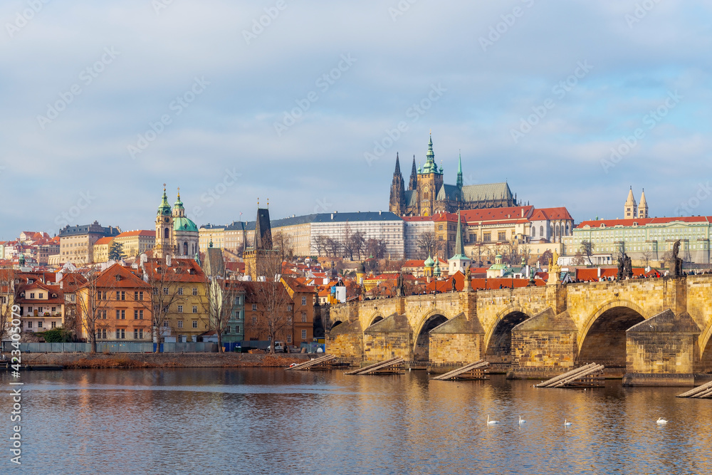 Cityscape of Prague at sunrise with view over Mala Strana district with Charles Bridge, Cathedral and Hradcany Castle, Czech Republic.
