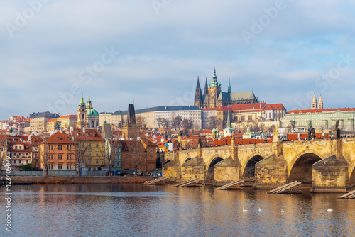 Cityscape of Prague at sunrise with view over Mala Strana district with Charles Bridge, Cathedral and Hradcany Castle, Czech Republic.