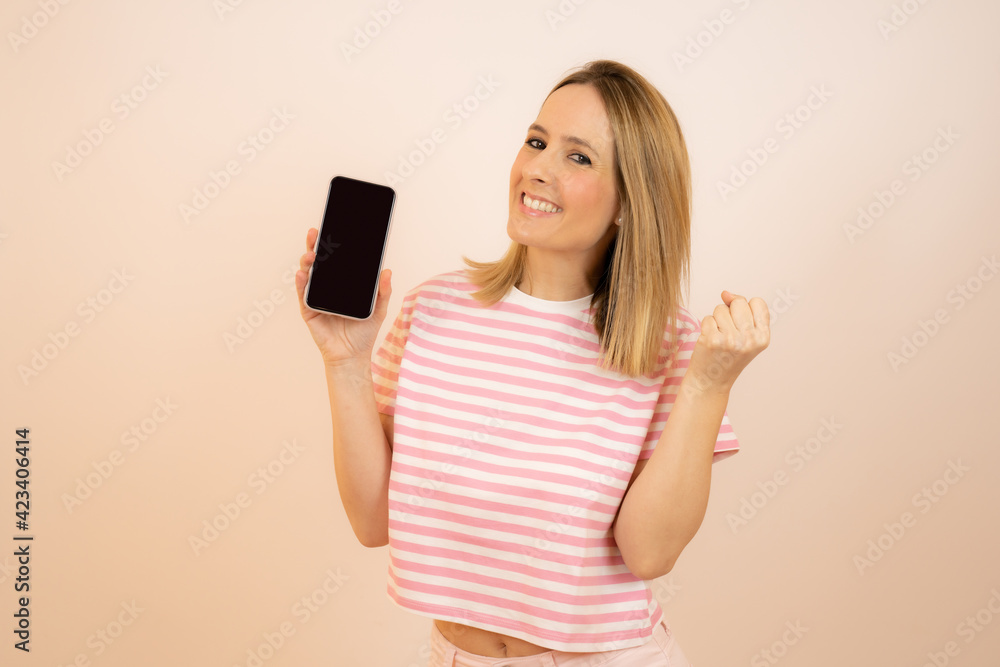 Portrait of young happy woman showing a mobile phone Portrait of young happy woman showing a mobile phone