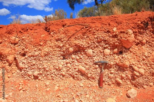 Geological rock exposure of Australian desert plain photo