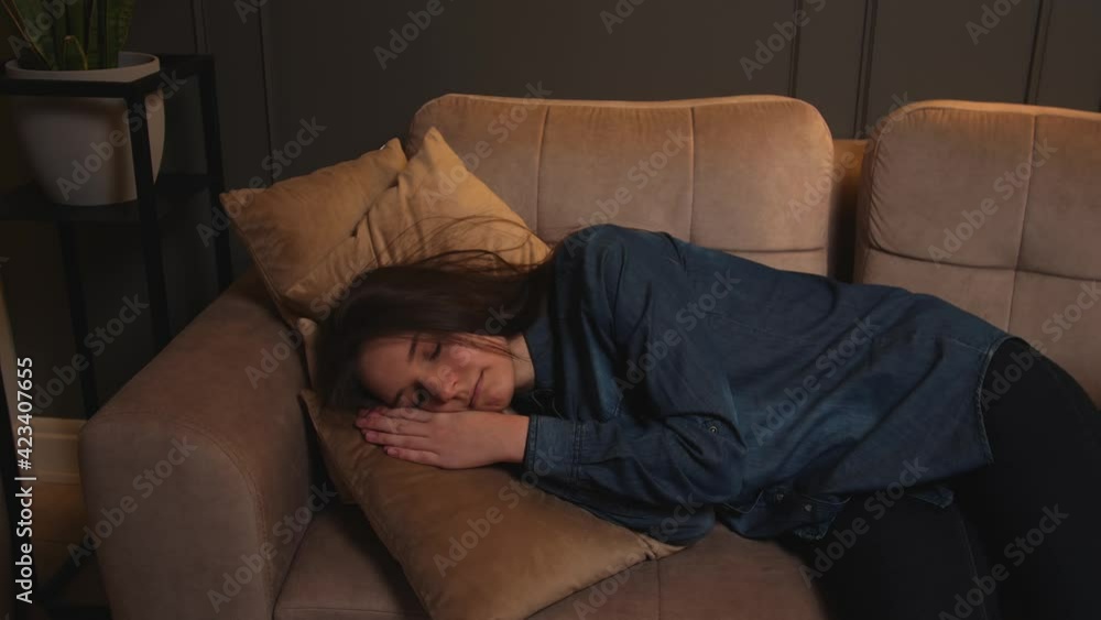 Portrait of tired young sleepy woman falls down on couch. Portrait of tired young sleepy woman falls down on couch.