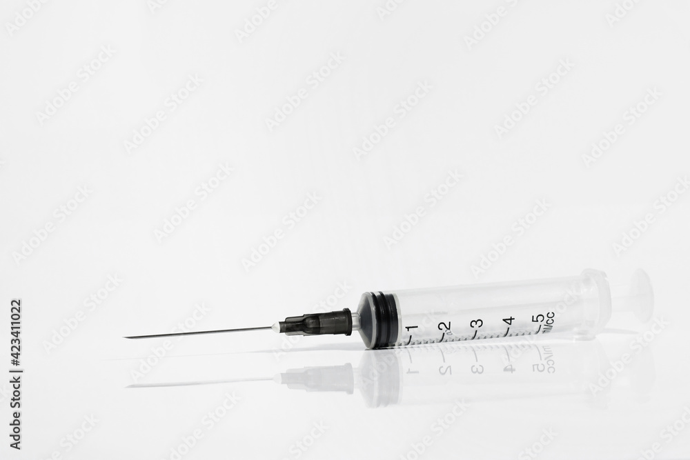 Medical syringe with reflection isolated on white background Medical syringe with reflection isolated on white background