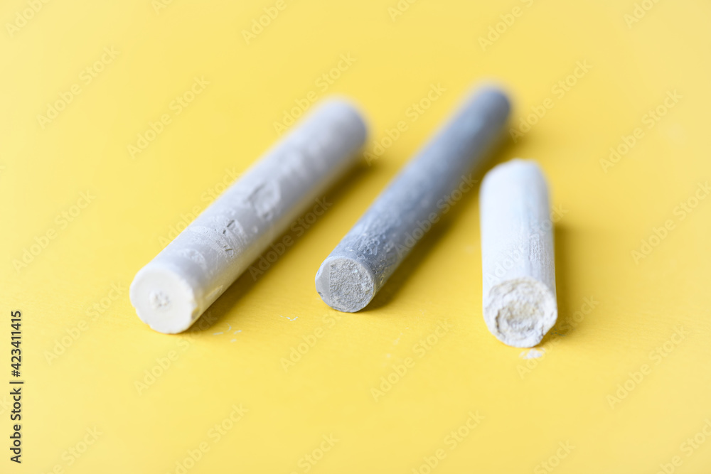 Soft pastels on yellow background. Close up. Soft pastels on yellow background. Close up.