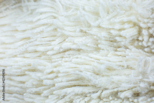 White cotton towel or carpet.fluffy texture background. Close up, macro photo. Soft focus image.