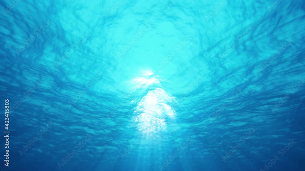 Underwater ocean waves ripple and flow with beautiful sun light rays. 4K seamless loop
