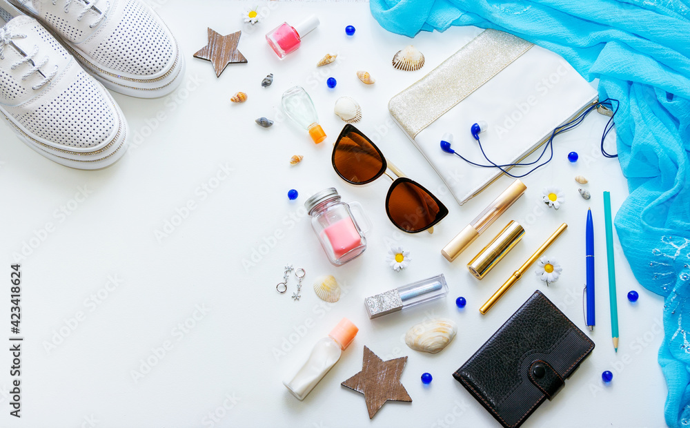 Outfit of young woman or modern teenager girl on white background - shoes, cosmetic and lifestyle accessories. Flat lay objects.