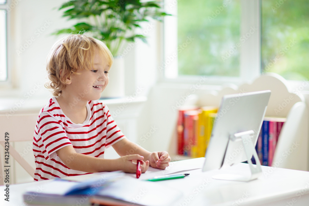 Online remote learning. School kids with computer. Online remote learning. School kids with computer.