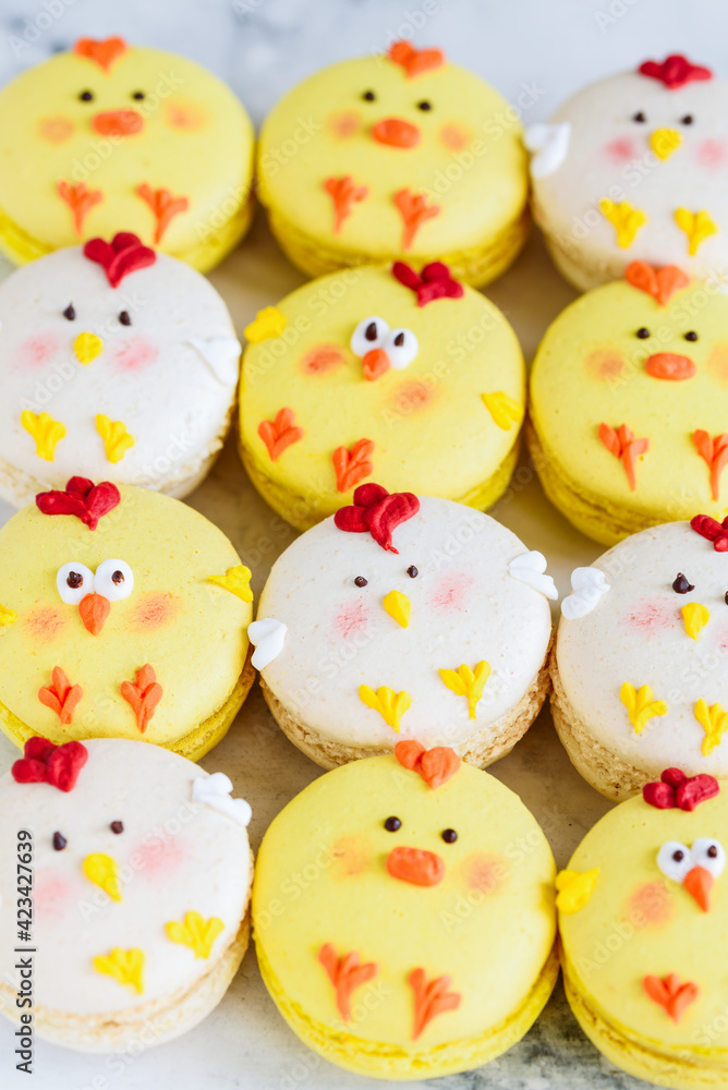 Easter macarons chicks background. Easter treat, dessert, symbol. Selective focus.