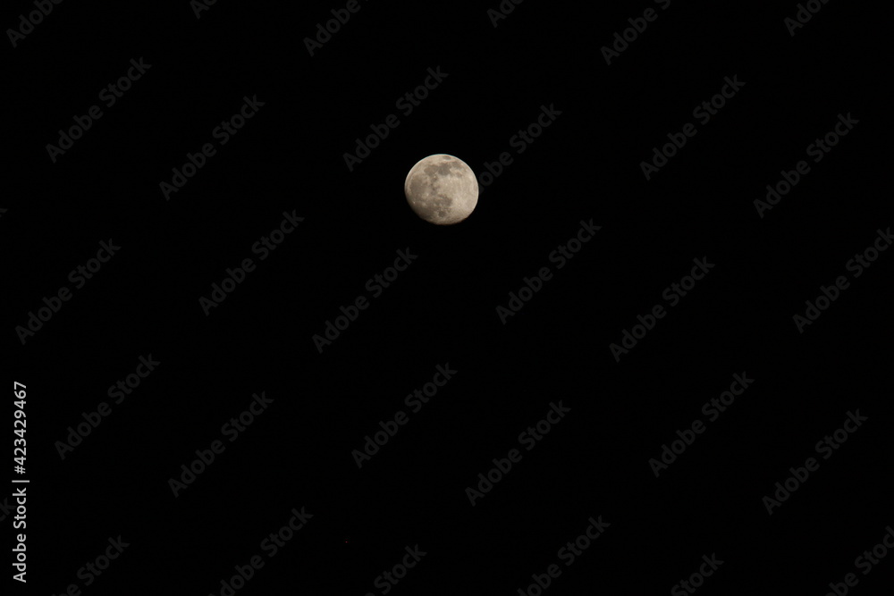 photograph of the moon, slightly missing to full disk visibility photograph of the moon, slightly missing to full disk visibility