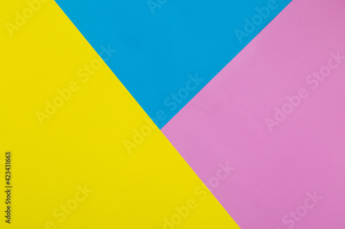 Colorful yellow, blue and pink pastel paper texture background, Geometric flat lay background.