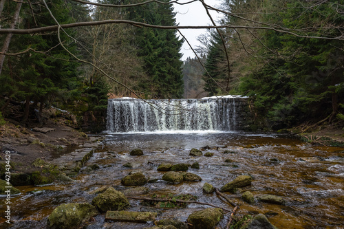 Cascade falls over mossy rocks