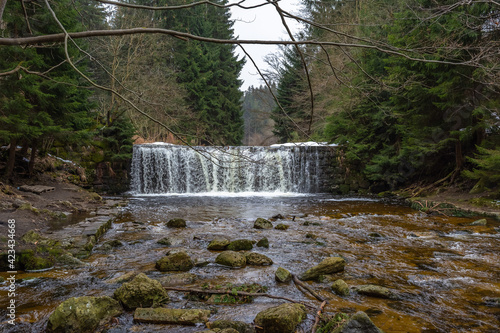 Cascade falls over mossy rocks
