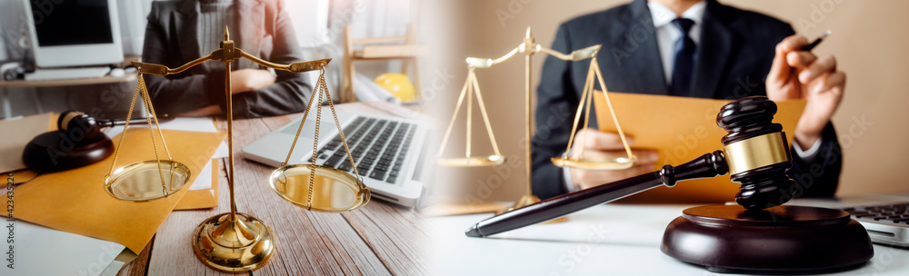Business and lawyers discussing contract papers with brass scale on desk in office. Law, legal services, advice, justice and law concept Business and lawyers discussing contract papers with brass scale on desk in office. Law, legal services, advice, justice and law concept