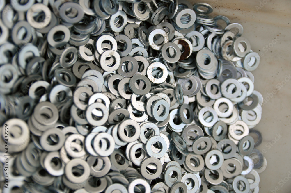 A set of mounting washers. Flat metal washer. Background. A set of mounting washers. Flat metal washer. Background.
