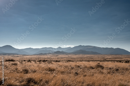 Vast Brown Field Below Layers of Great Basin's Mountains