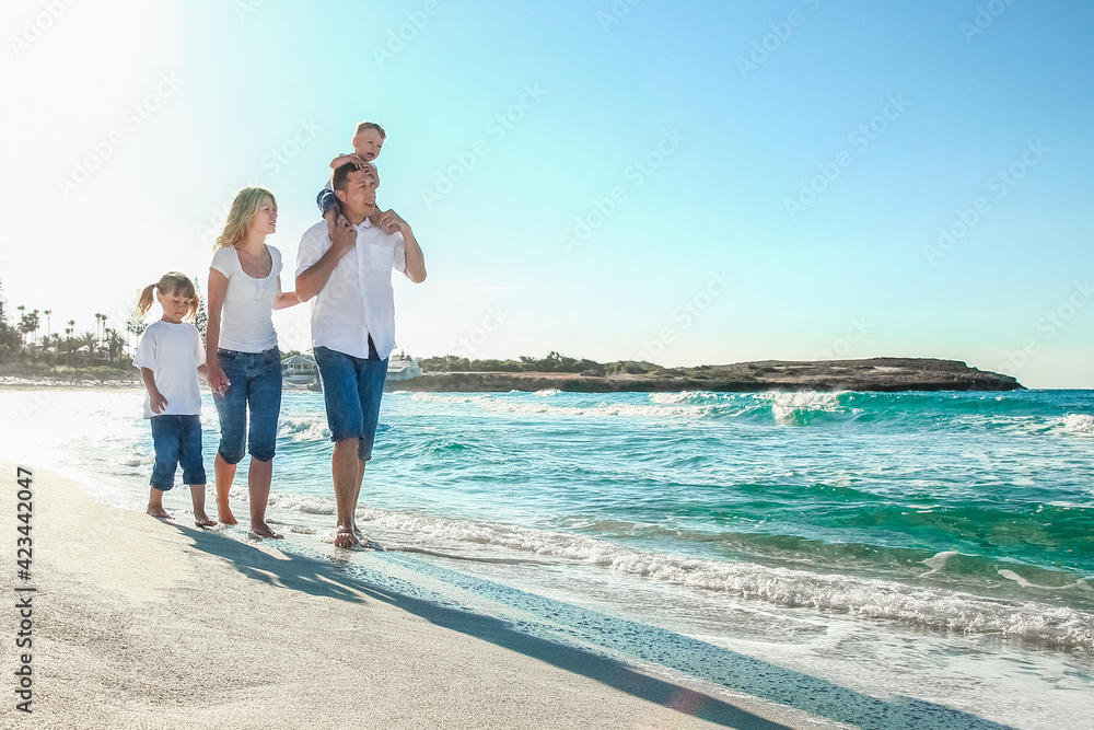 happy family by the sea in the open air