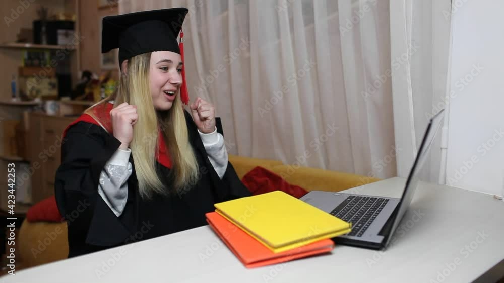 Virtual graduation and convocation ceremony. Excited student wearing ...