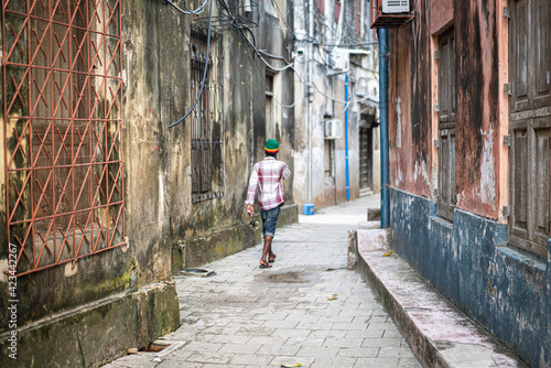 Young black man on city street alone © Jasmin Merdan