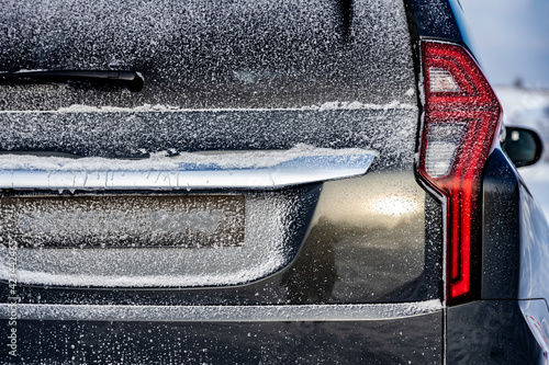 Wallpaper Mural Rear red LED lights. close-up. SUV in winter. snow and icing on the car. The frame of the license plate is empty. mockup blank Torontodigital.ca