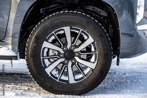 Wheel. Cast wheel with tires close-up. Worn on an SUV. winter, snow on wheels. © Dmitry Dven