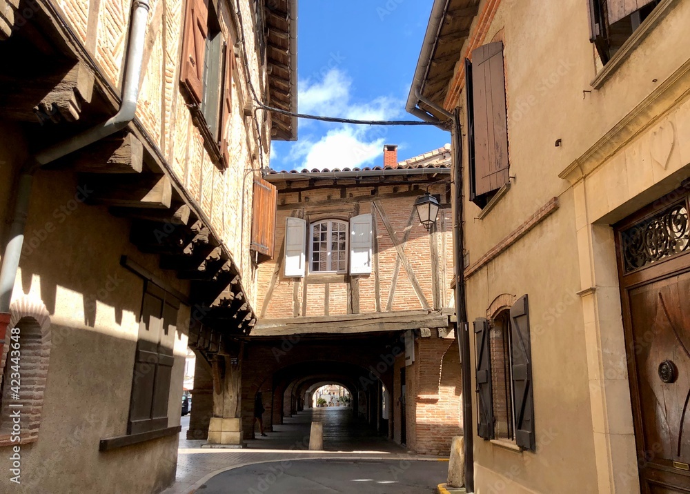 old street in medieval town of lisle-sur-tarn