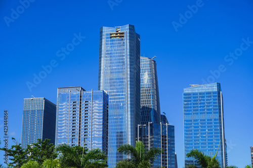 a close-up shot of grouped skyscrapers under blue sky in qianhai sub-district of shenzhen  China