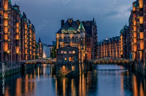View of the Speicherstadt at night.in Hamburg  Germany..Illuminated Speicherstadt as seen from the Poggenm  hlenbr  cke.