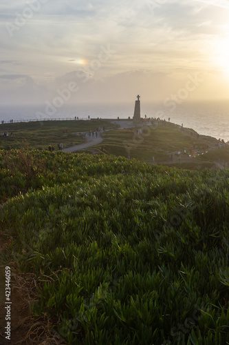 beautiful view on the pic of the hill with people  the most western european point Cabo da Roca