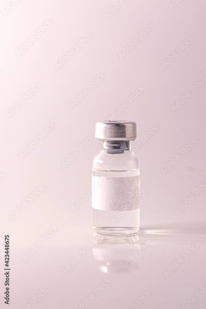 Doctor holding vial with vaccine against Covid-19 on light background, closeup. Coronavirus Vaccine / Corona virus Vaccine concept with syringe. Vaccine Concept of fight against coronavirus.
Doctor holding vial with vaccine against Covid-19 on light background, closeup. Coronavirus Vaccine / Corona virus Vaccine concept with syringe. Vaccine Concept of fight against coronavirus.