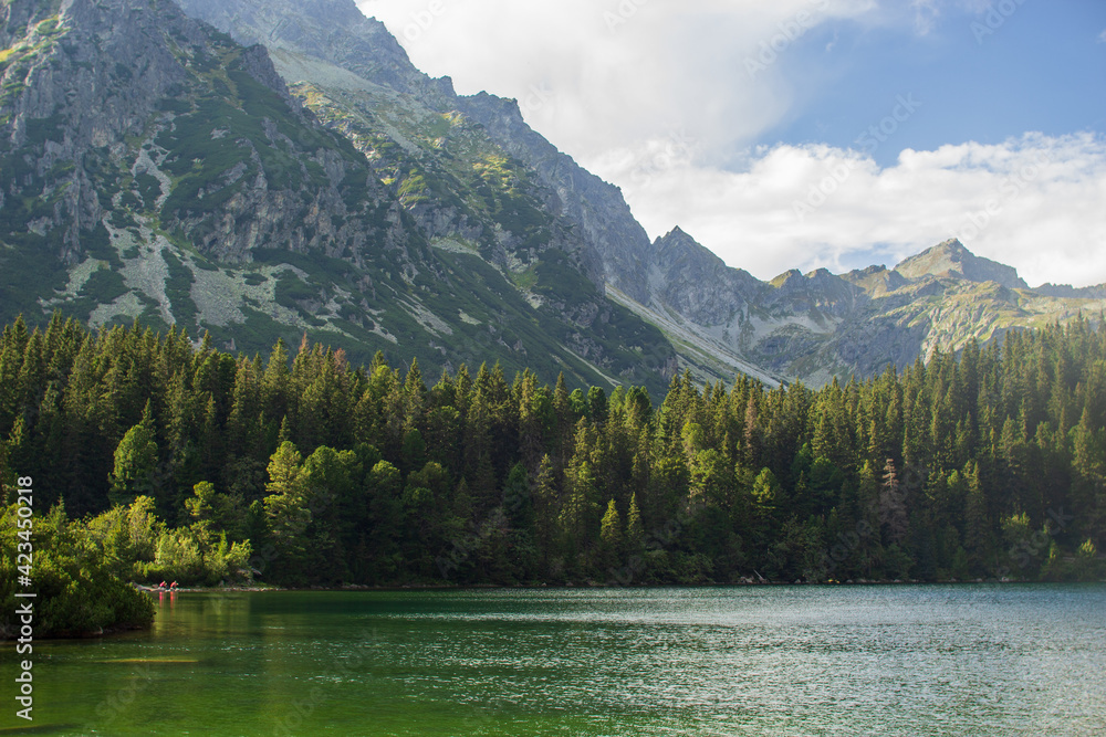 Picturesque green top of  mountain with lake in the High Tatras of Slovakia