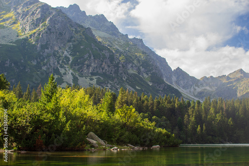 Picturesque green top of mountain with lake in the High Tatras of Slovakia