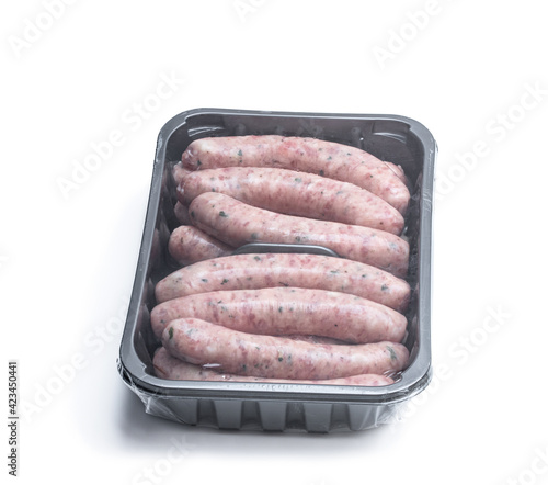 Pork sausages chipolatas in plastic pack isolated on white