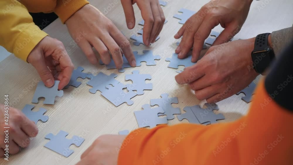 Teamwork concept. a group of people a team assemble jigsaw puzzles solve a problem. Business teamwork concept. community of people together put the puzzles. Business solution. partnership support Teamwork concept. a group of people a team assemble jigsaw puzzles solve a problem. Business teamwork concept. community of people together put the puzzles. Business solution. partnership support
