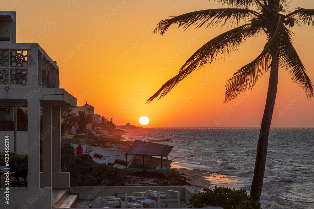 Beautiful yellow orange sunset sky over the sea and beach with ...