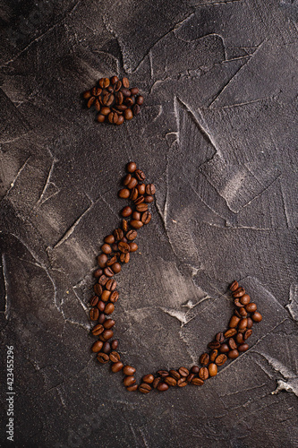 question mark made of coffee beans on black base market concept