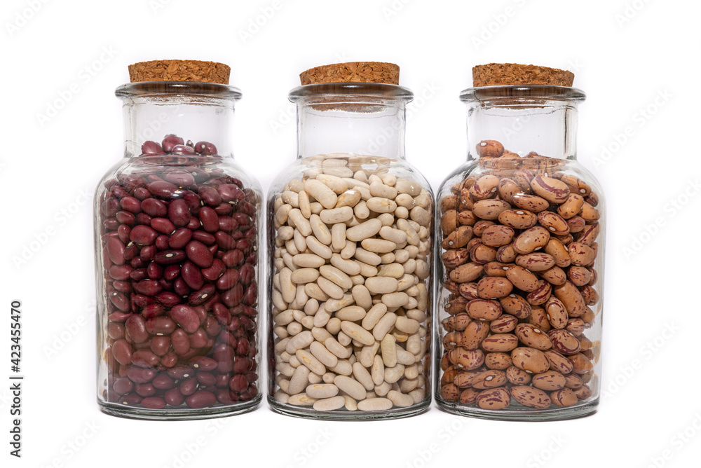 Threer Jars of dried beans, White, Borlotti and Kidney Beans isolated on a white background.. Dried for storage and preservation, long shelf life nutritional food. Threer Jars of dried beans, White, Borlotti and Kidney Beans isolated on a white background.. Dried for storage and preservation, long shelf life nutritional food.