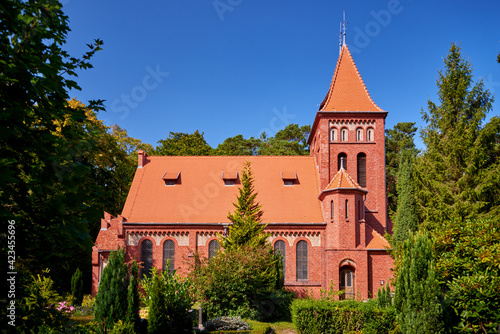 red brick church in the forest