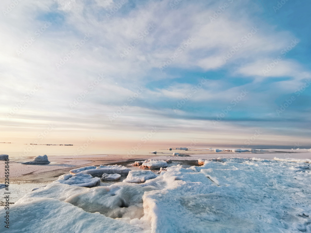 Sunset over frozen ice in sea Sunset over frozen ice in sea
