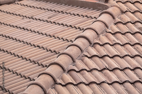 Clay roof of the house is dark brown background ribbed base