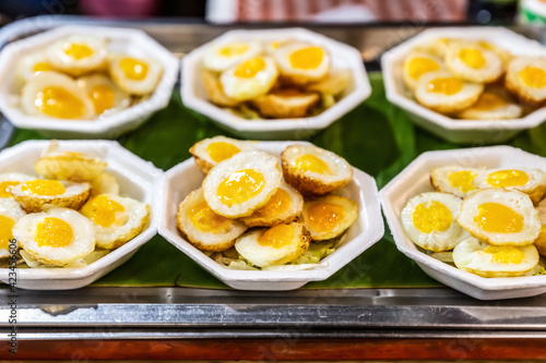 fried eggs fast street thailand background culinary closeup