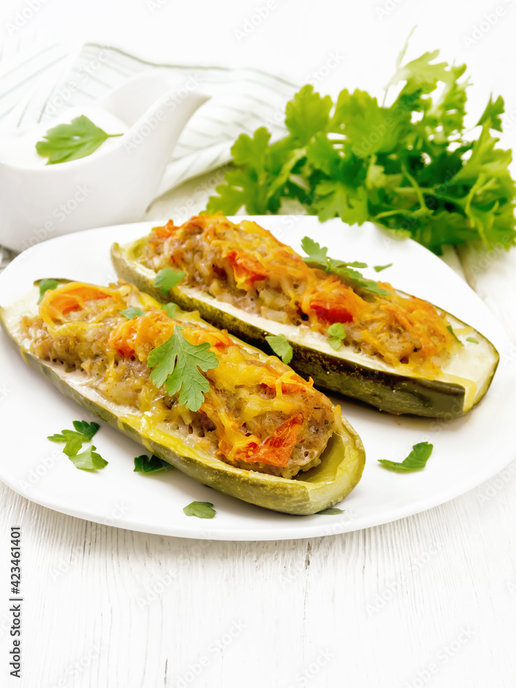 Cucumber stuffed with meat and vegetables on white board Cucumber stuffed with meat and vegetables on white board