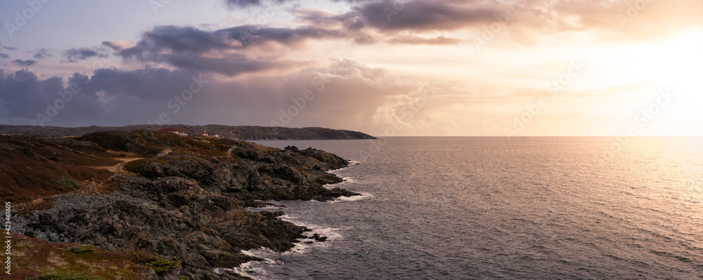 Viewpoint on the Rocky Atlantic Ocean Coast. Colorful Sunrise Sky Art Render. Taken in Saint Anthony, Newfoundland, Canada.