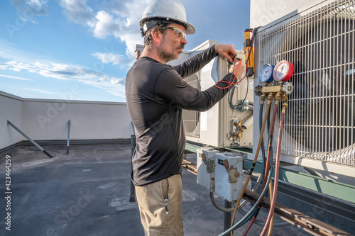 HVAC technician troubleshooting photo