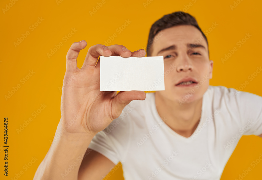 guy with a white card on a yellow background Copy Space mockup guy with a white card on a yellow background Copy Space mockup