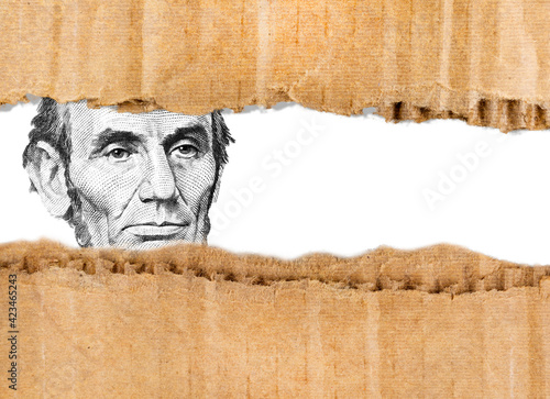 President Abraham Lincoln $5 through ripped cardboard