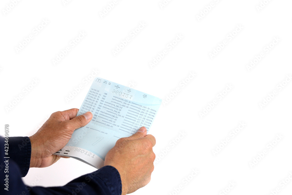Naklejka premium Hand holding passbook on the white background.